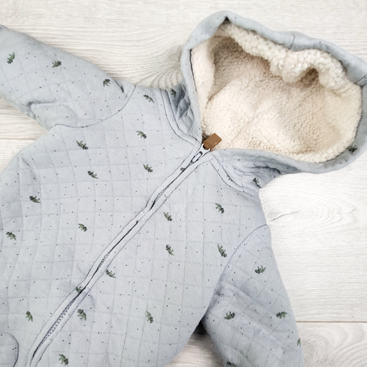 Carters blue quilted sherpa lined bunting suit with dinosaurs. Newbon size