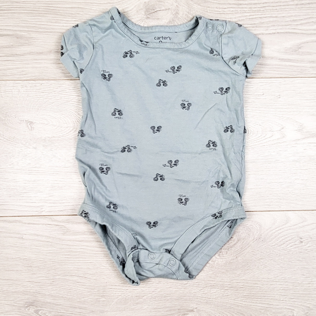 Carters blue-grey bodysuit with trikes. Size 9 months