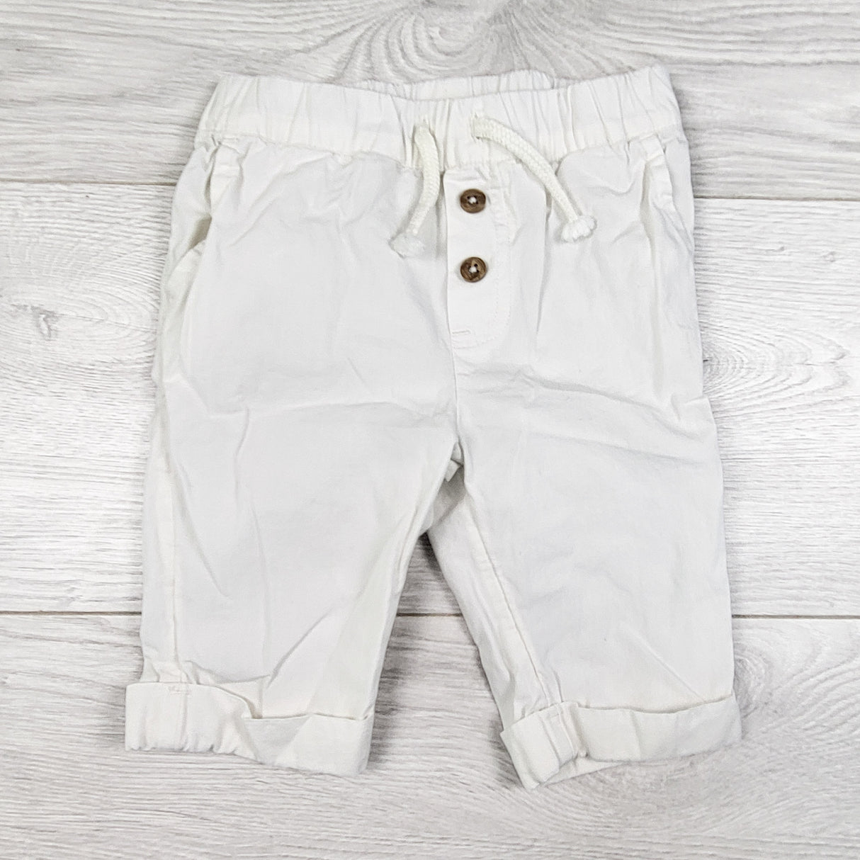 Rise Little Earthling white drawstring pants. Size 3-6 months