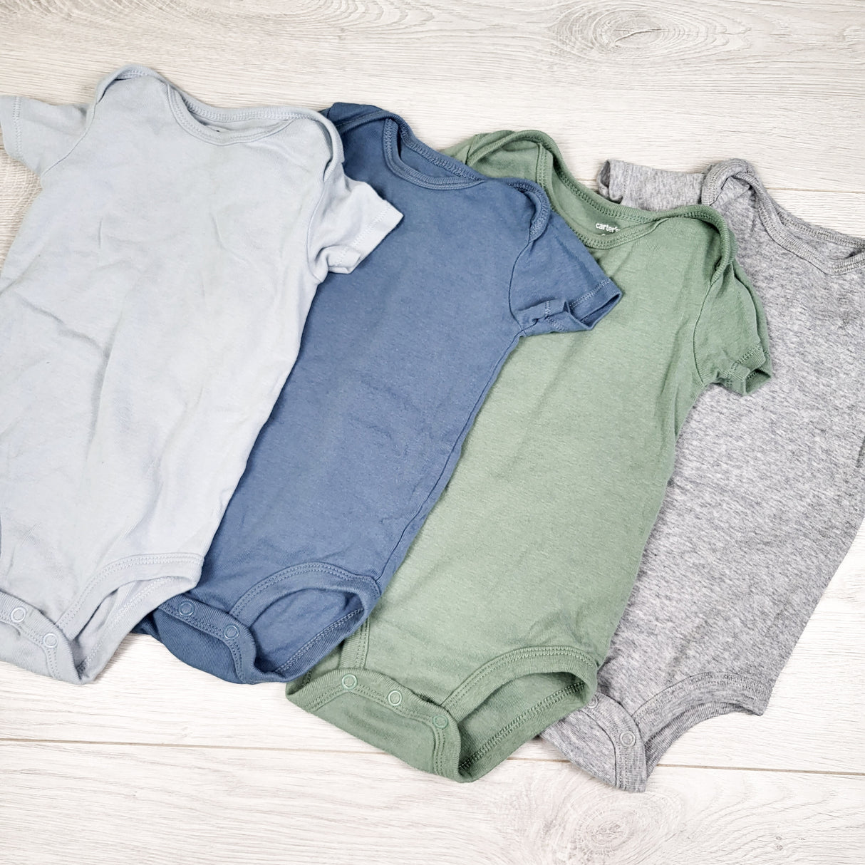 Carters 4-pack bodysuits. Size 9 months