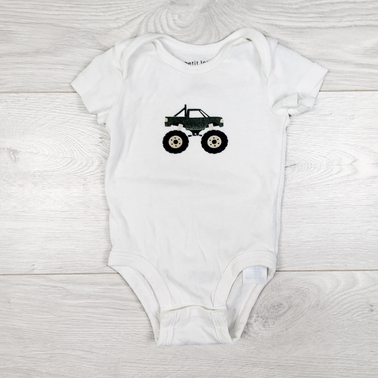 Petit Lem white bodysuit with monster truck. Newborn size