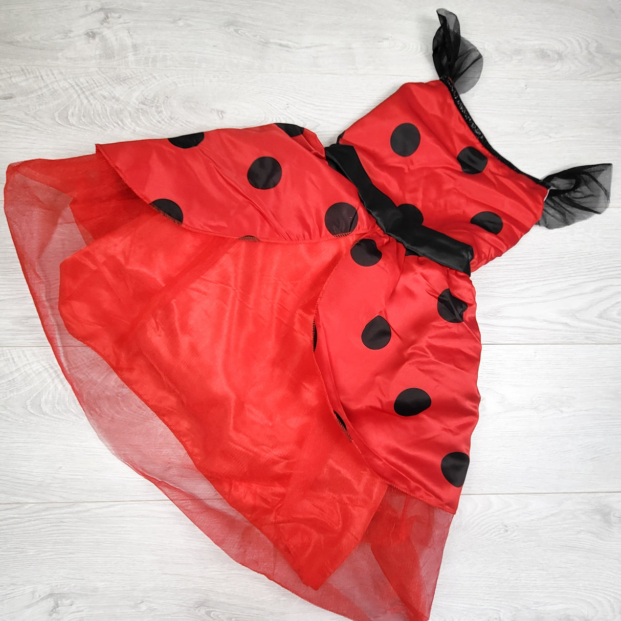 Ladybug print dress. Size large (approx 5 to 6 Years)
