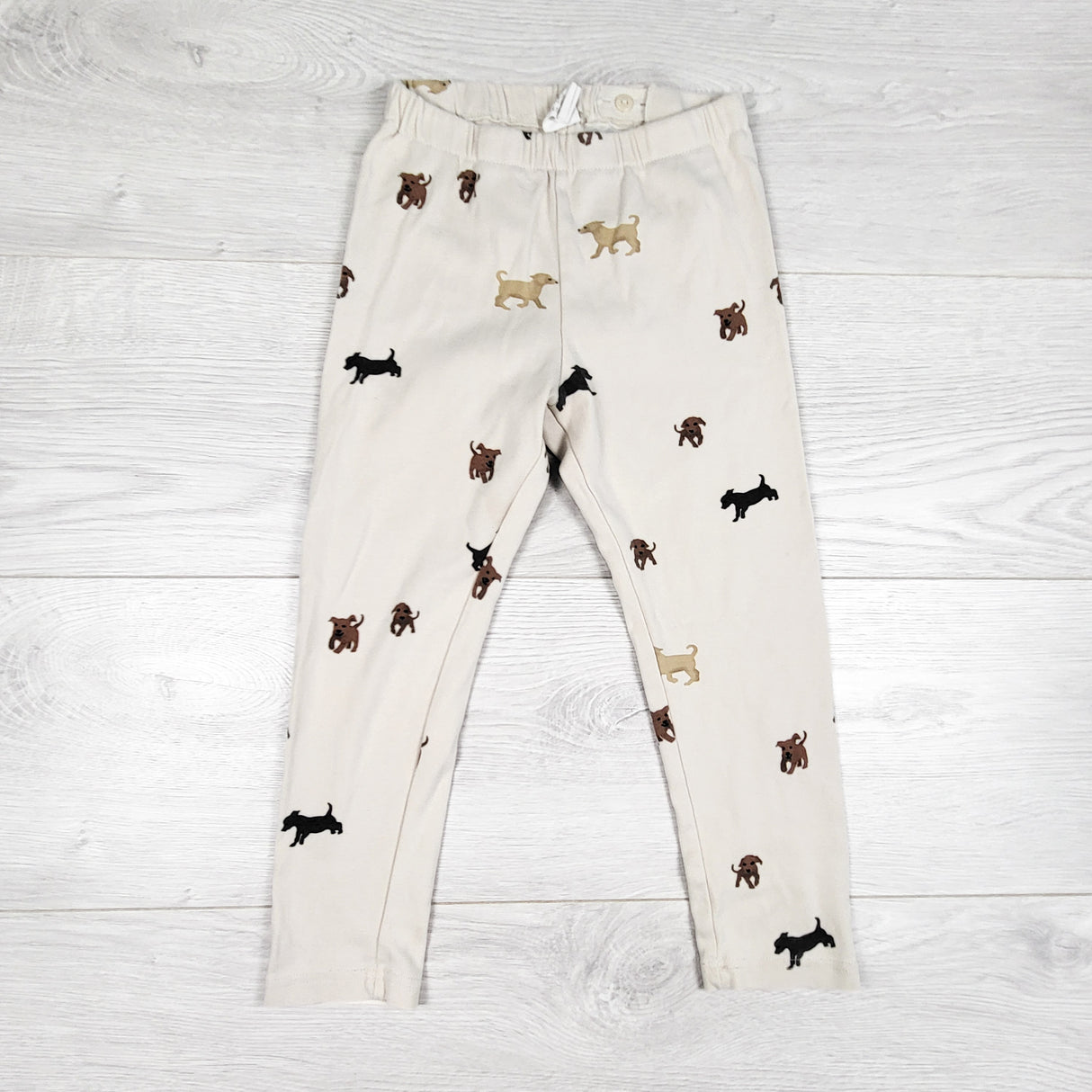 H and M cream coloured leggings with dogs. Size 3/4T