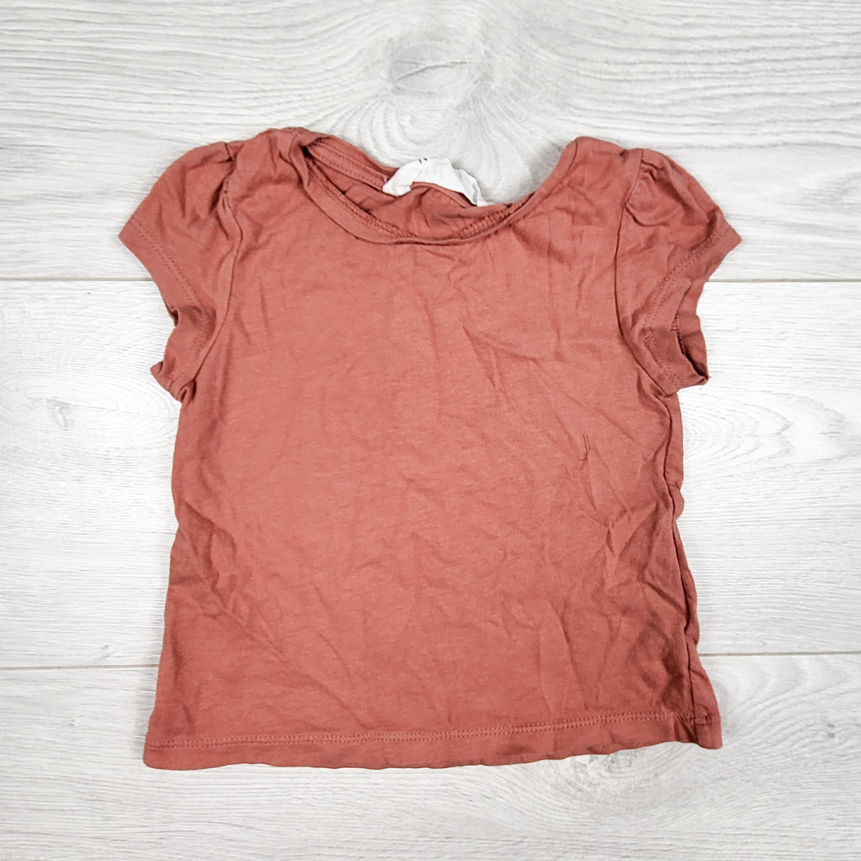 H and M pinky-coral t-shirt. Size 2-4T
