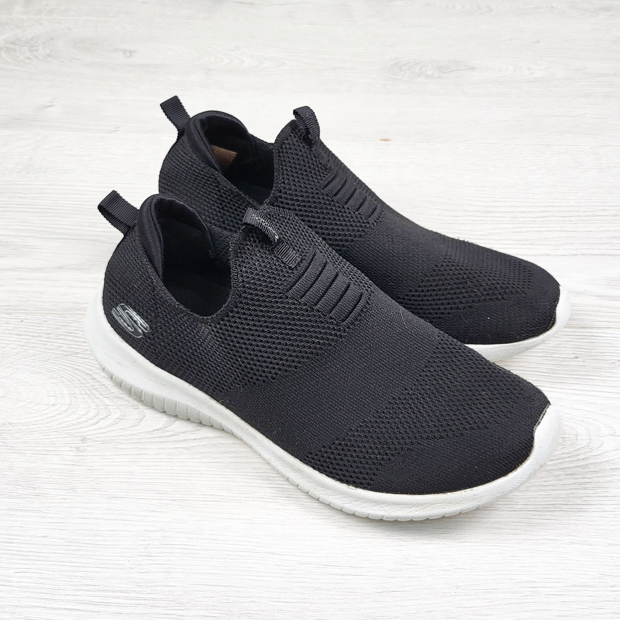 Skechers black "Step-ins" slip on shoes. Youth size 4