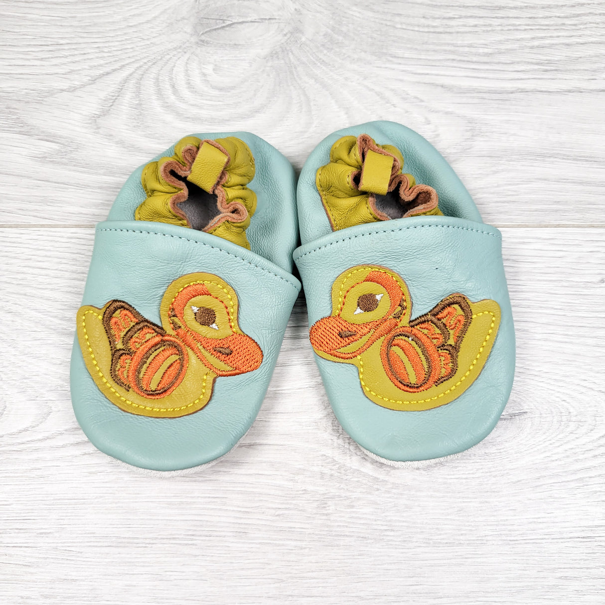 Native Northwest duck design soft sole leather shoes. Size 12-18 months