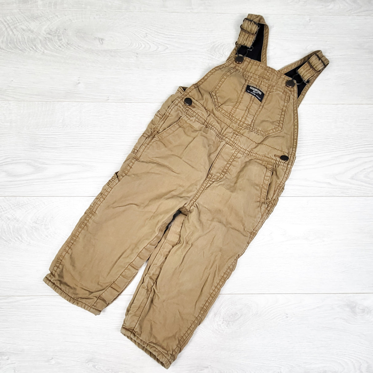 Oshkosh tan jersey lined twill overalls. Size 24 months
