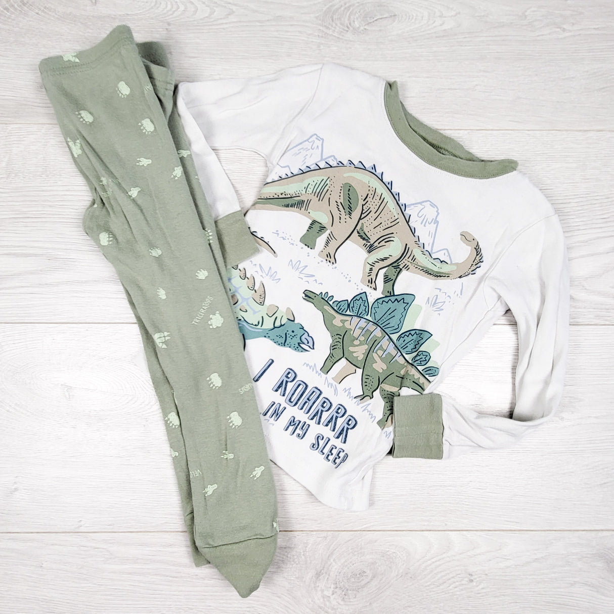 Carters white and green 2pc PJs with dinosaurs. Size 3T