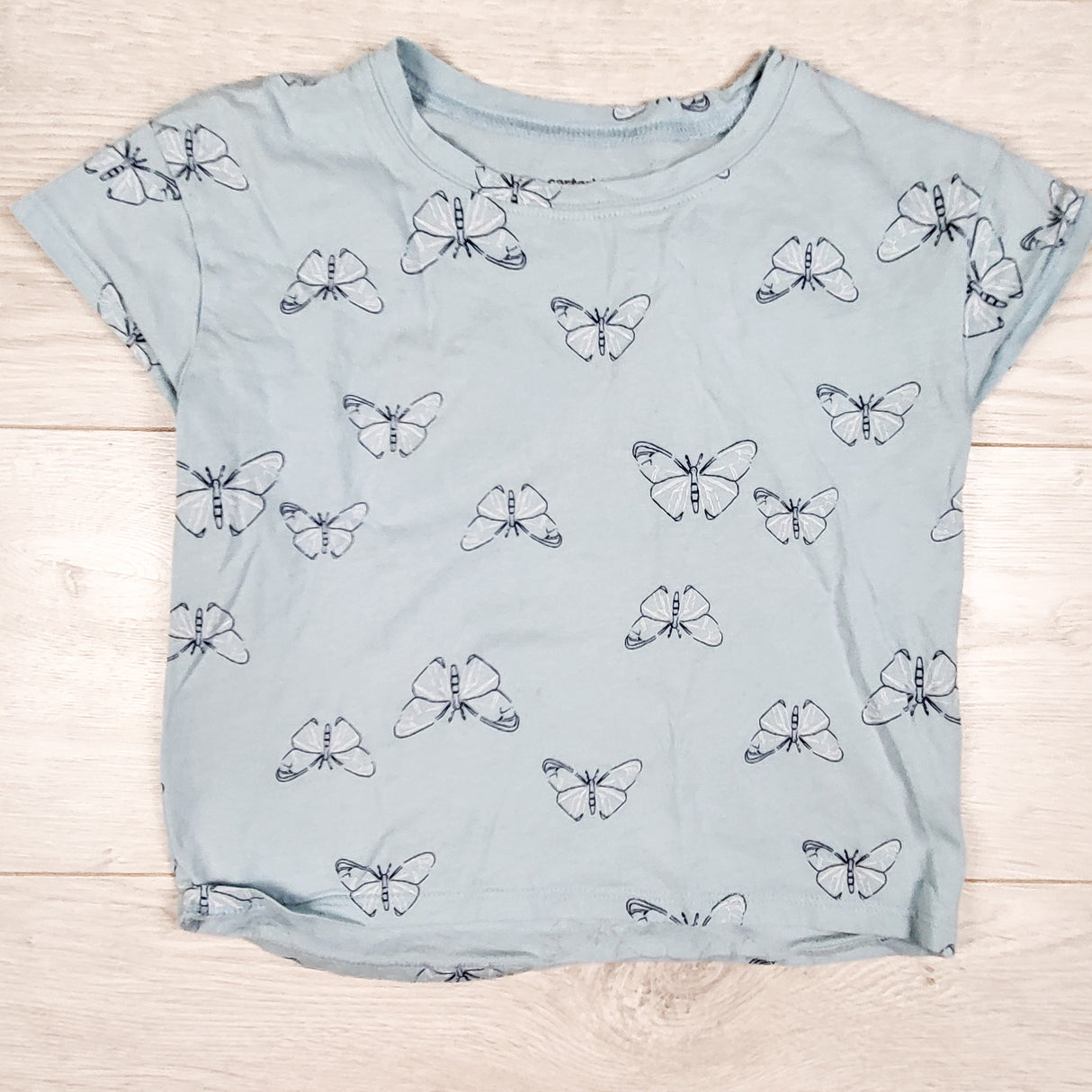 Carters blue butterfly print t-shirt. Size small (6/7)