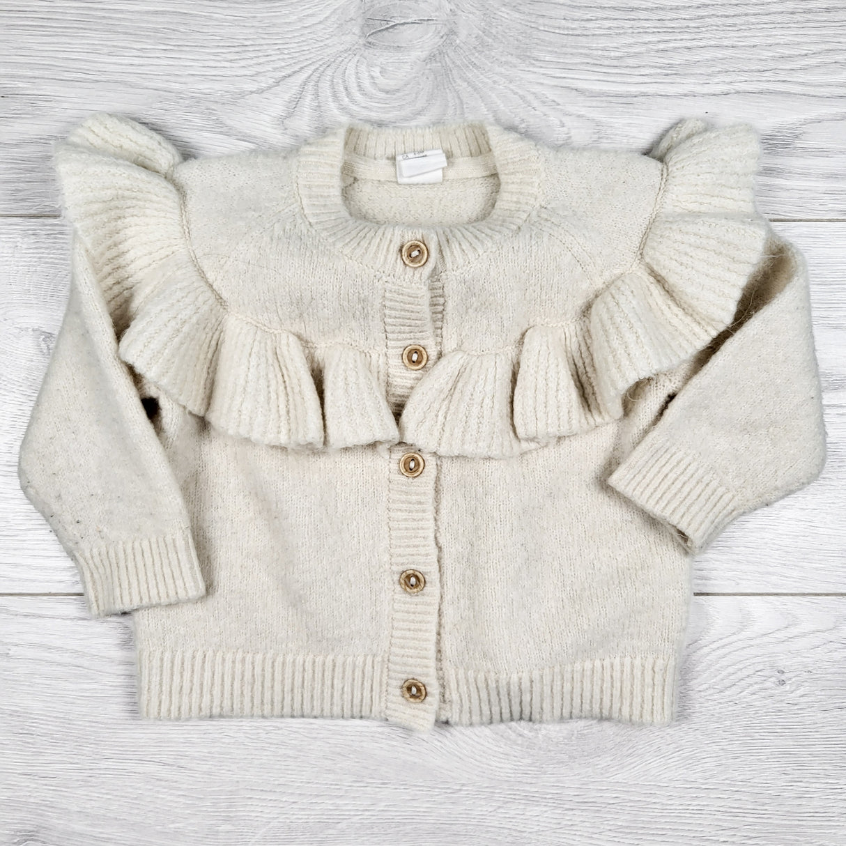 H and M oatmeal cardigan sweater with ruffles. Size 4-6 months