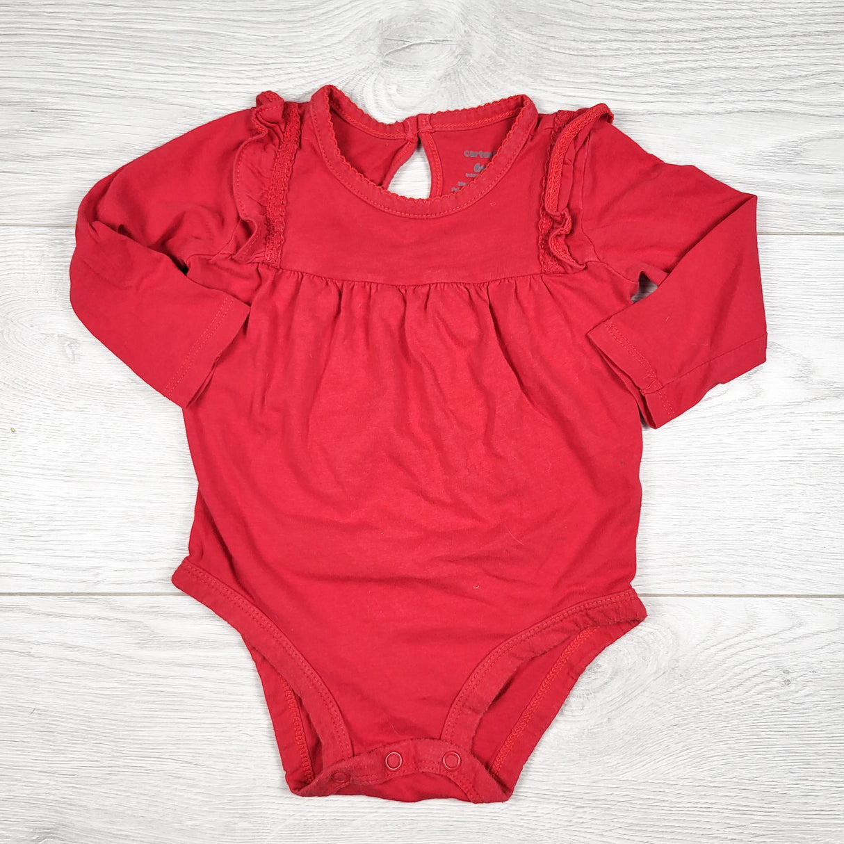Carters red ruffle bodysuit. Size 6 months