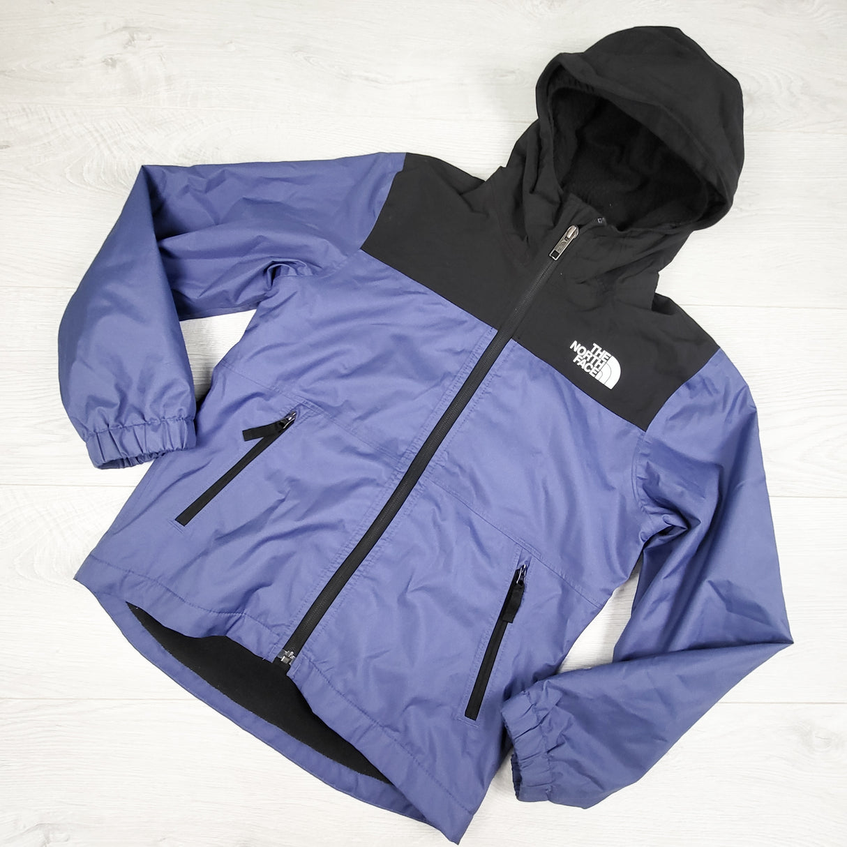 The North Face blue-purple / black Warm Storm Rain jacket. Size 7/8
