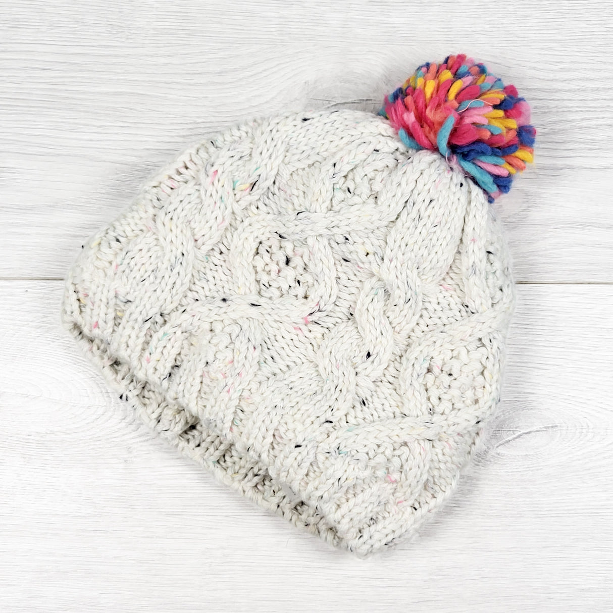Carters fleece lined cable knit toque with pom pom. Size 8