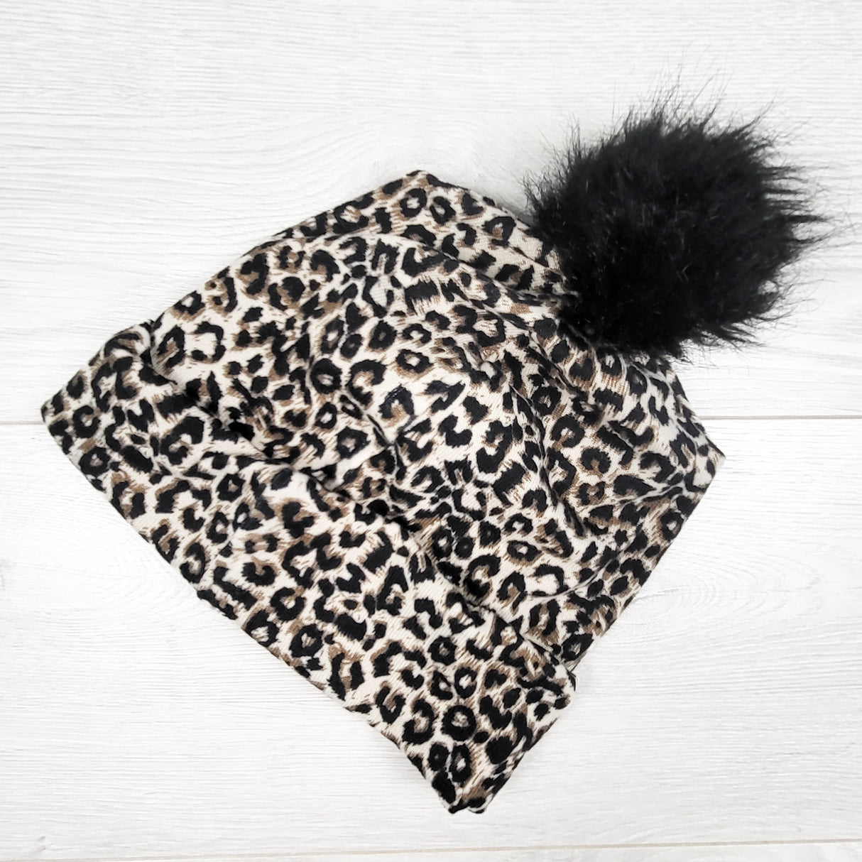 Teddy Little Apparel leopard print pom pom beanie. One size fits all
