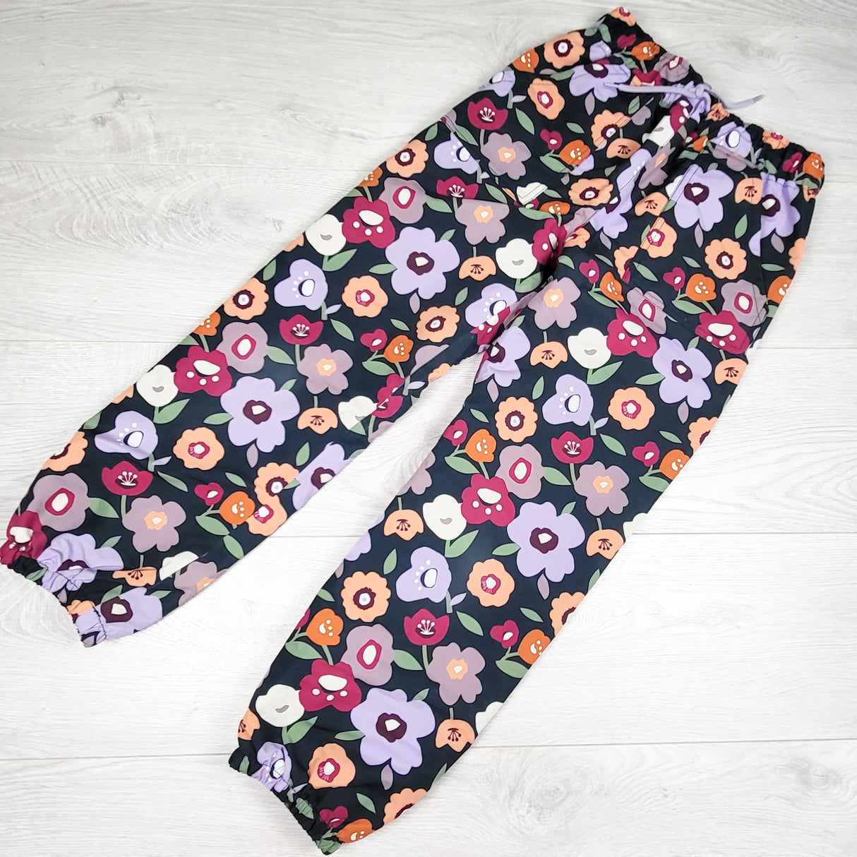 Jan and Jul fleece lined floral print rain pants. Size 8