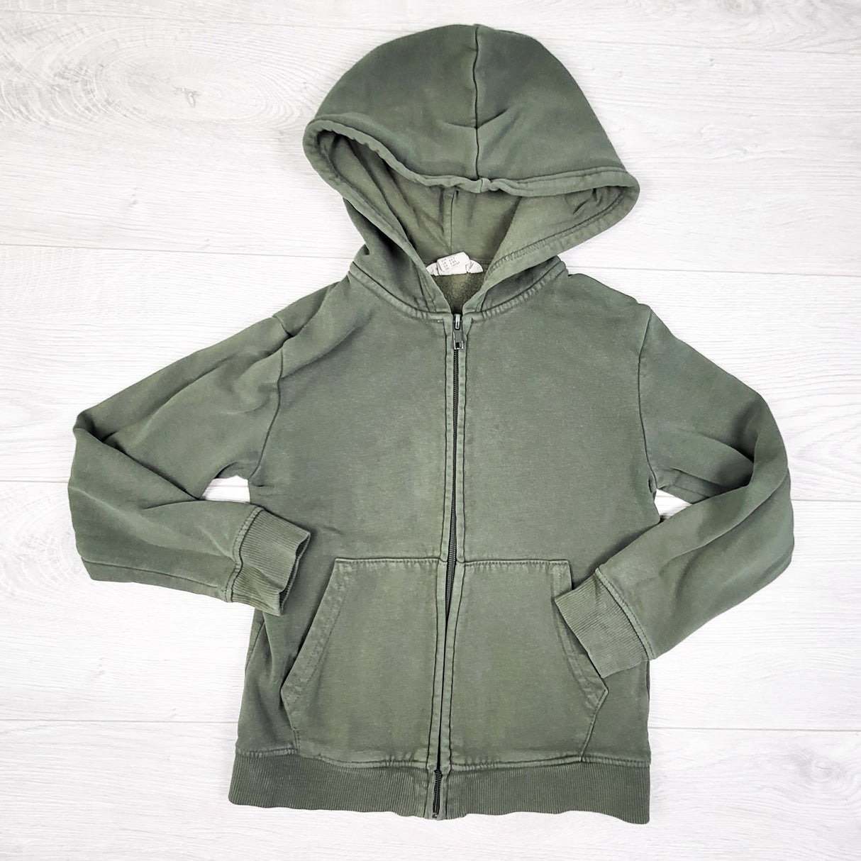 H and M green zip up hoodie. Size 6-8 Years