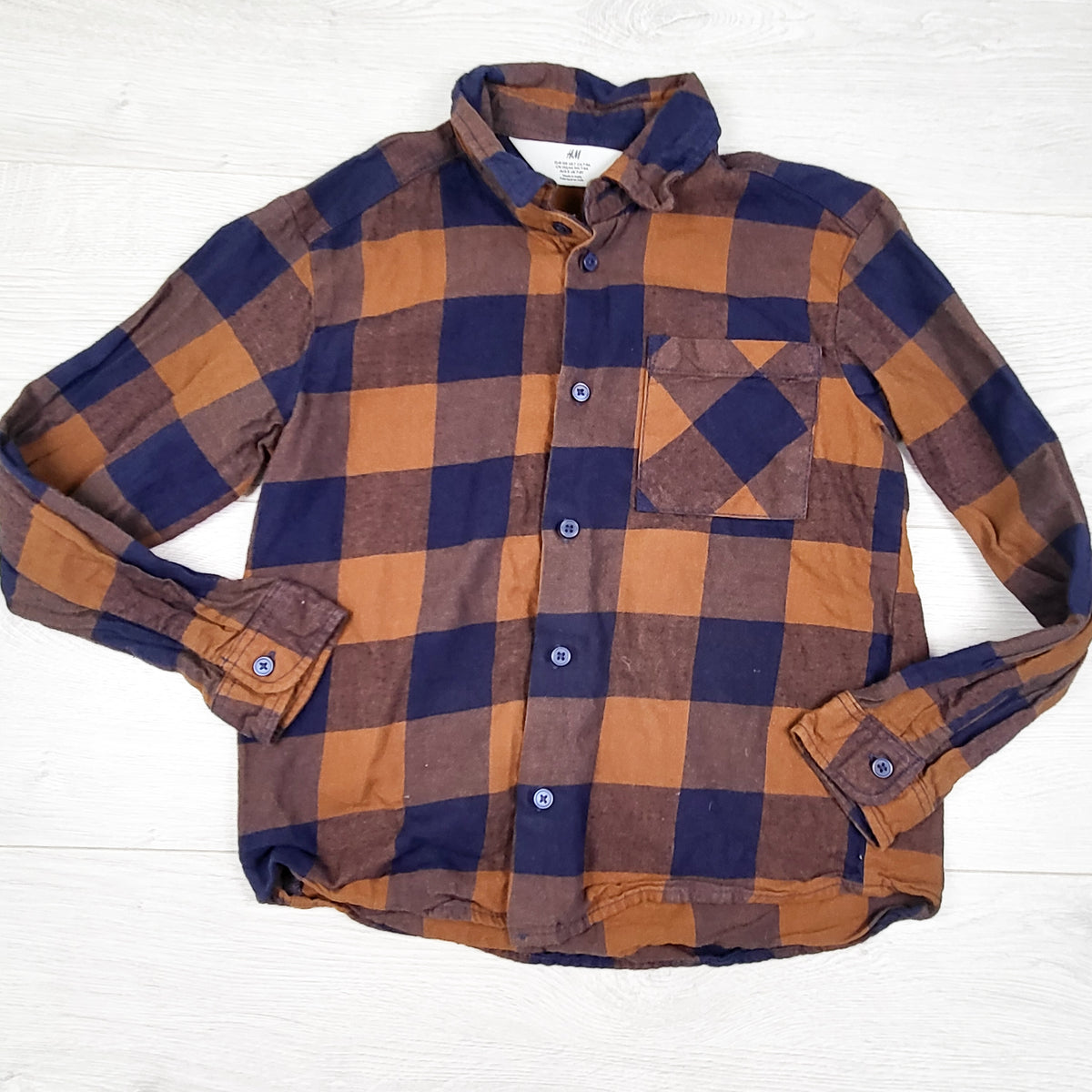 H and M tan and navy plaid button up flannel shirt. Size 7/8