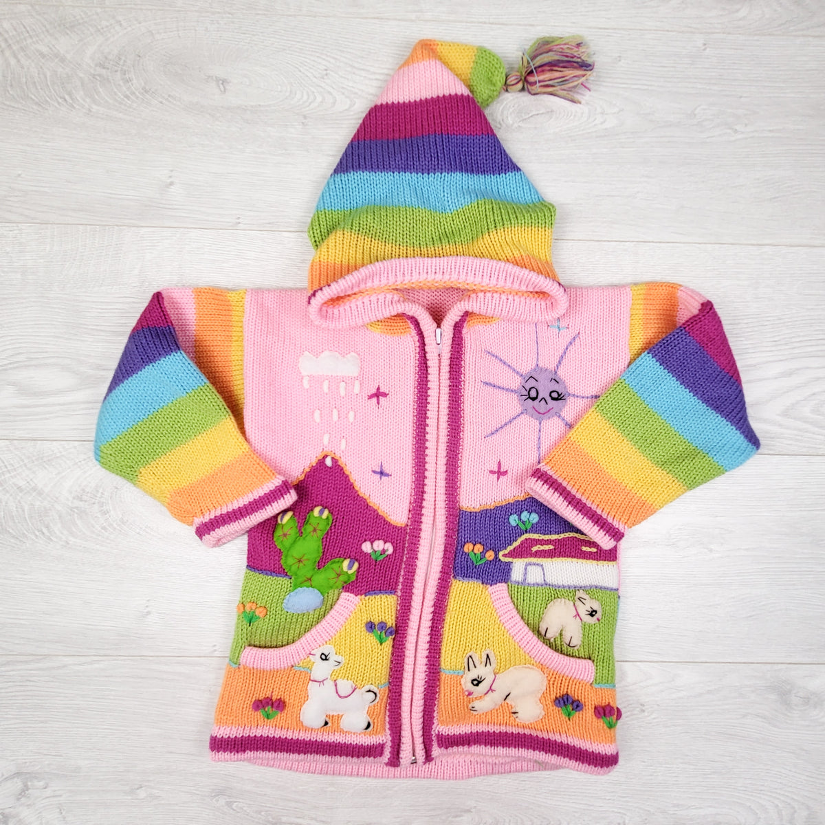 Pink hooded Peruvian sweater.  Approx size 6-8 Years