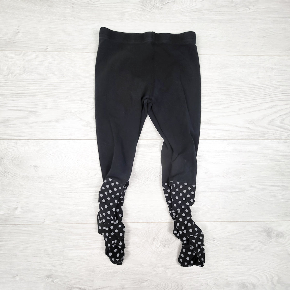 Peekaboo Beans black and polka dot ruched leggings. Size 4T