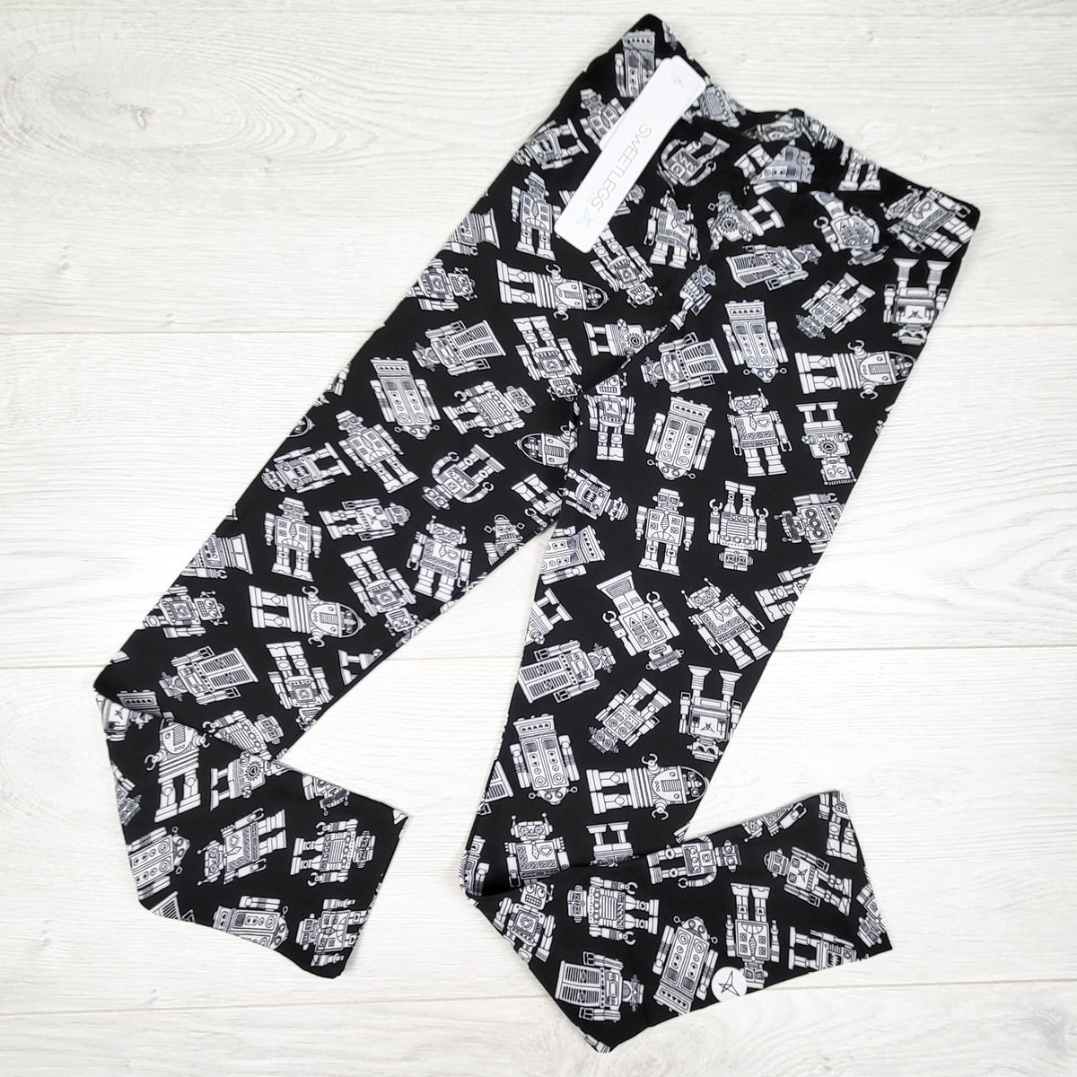 NEW - Sweetlegs robot print leggings. Size 6-8 Years