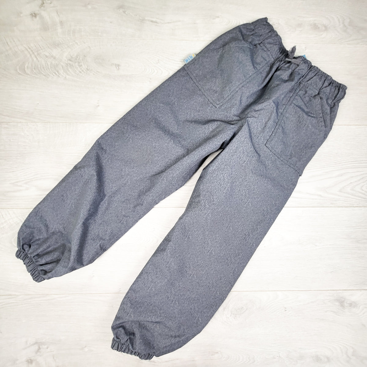 Jan and Jul grey fleece lined rain pants. Size 6