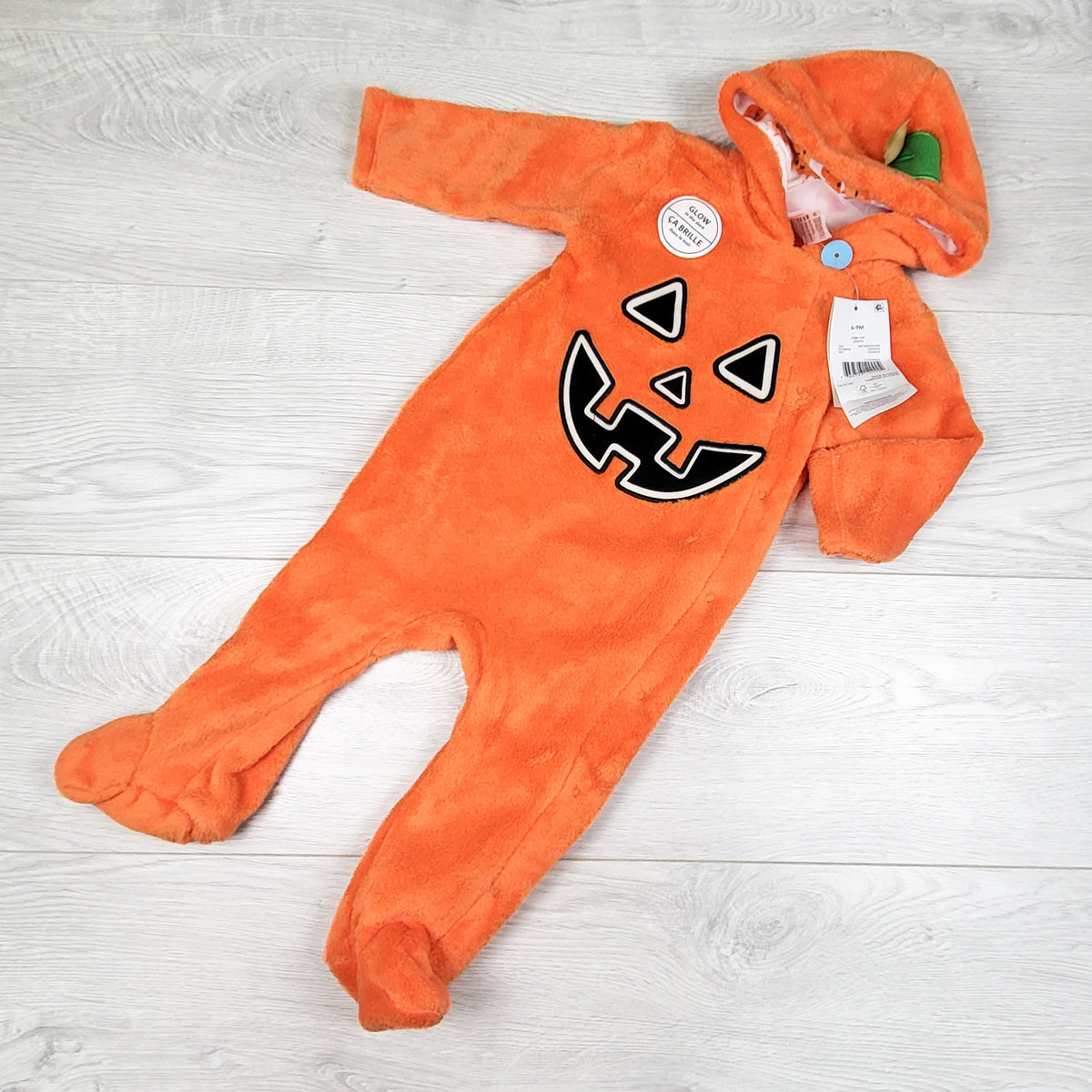 NEW - George plush Jack-o-lantern glow in the dark bunting suit. Size 6-9 months