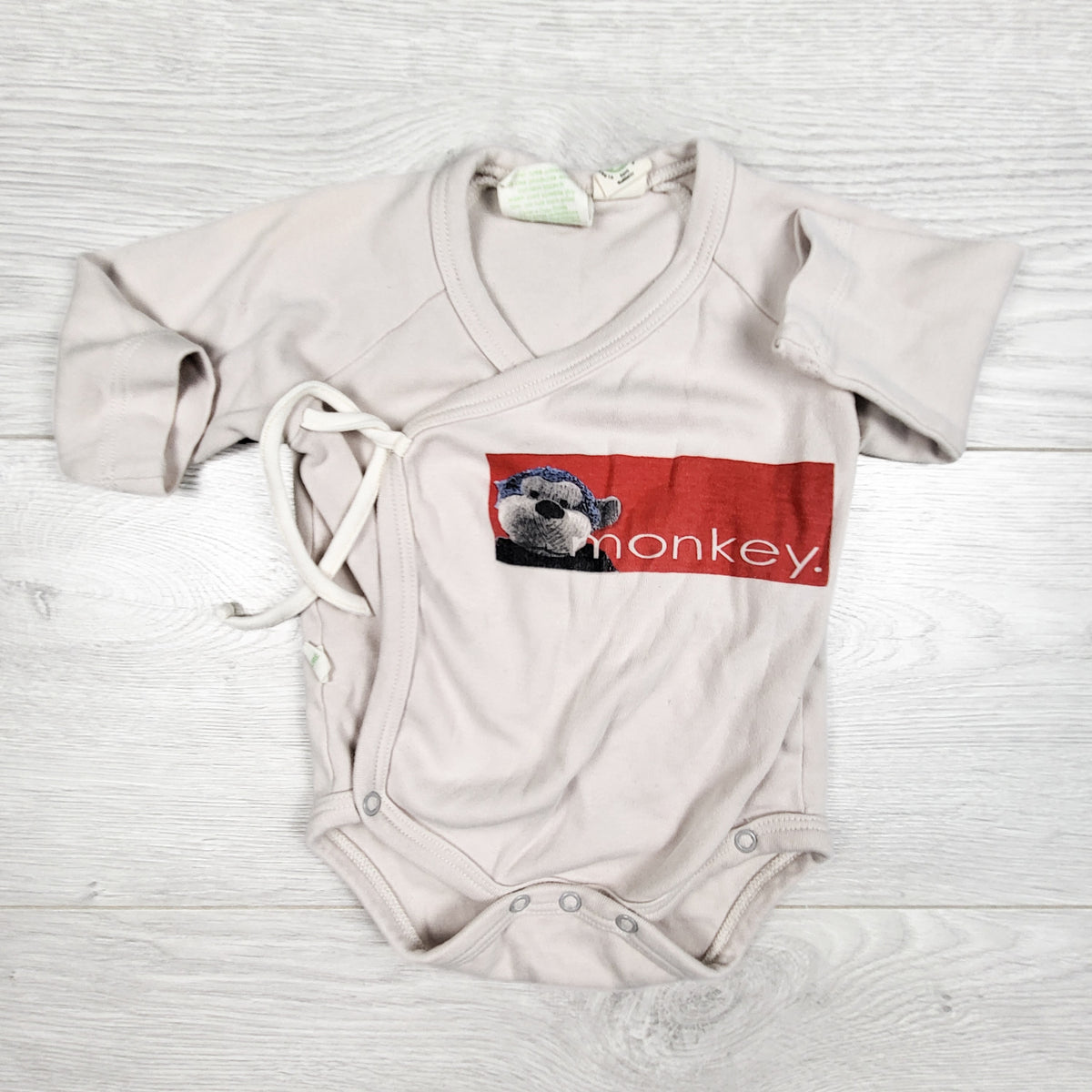 Parade Organics organic cotton monkey print wrap bodysuit. Size 3-6 months