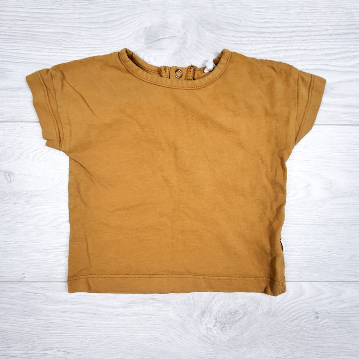 Nui golden yellow coloured organic cotton t-shirt. Size 6-12 months