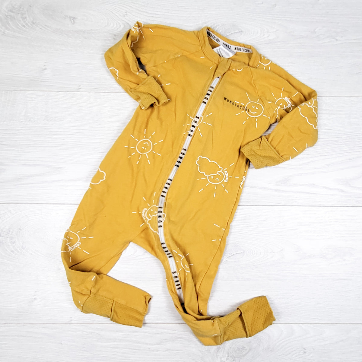 Bonds yellow wondersuit with clouds and suns. Size 6-12 months