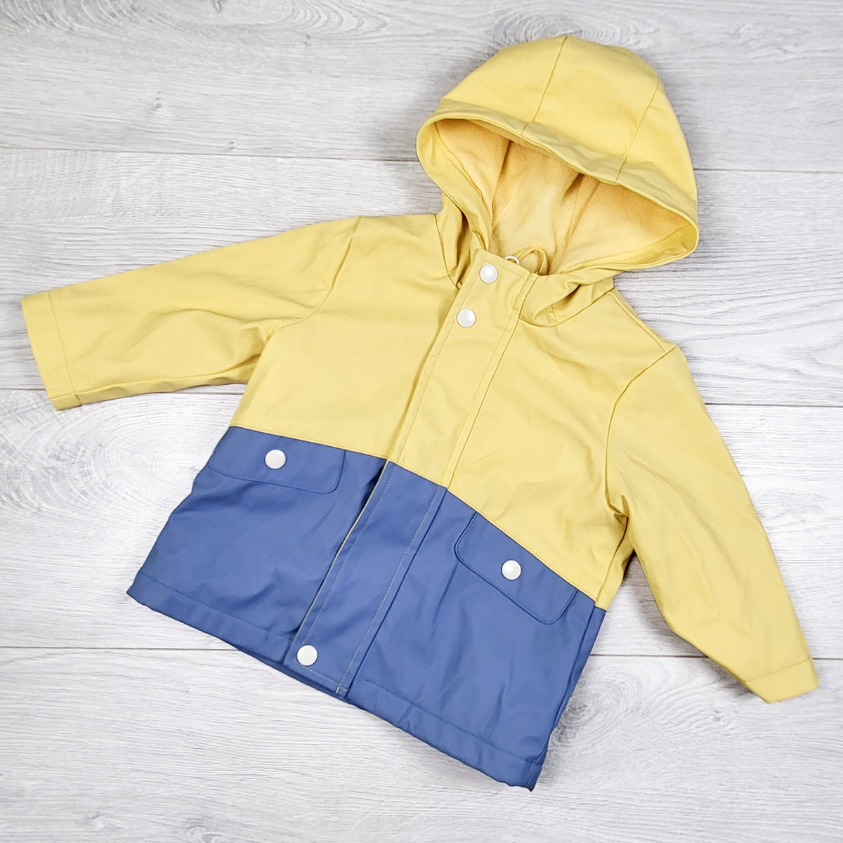 Primark blue and yellow jersey lined rain jaacket. Size 6-9 months