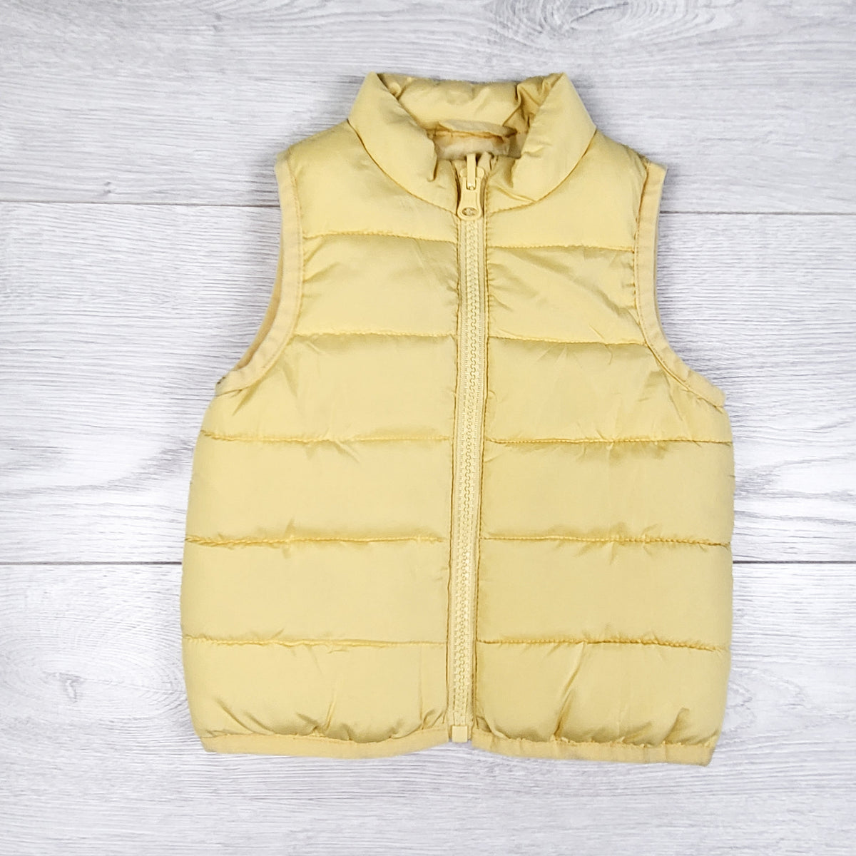 Primark yellow quilted vest. Size 6-9 months