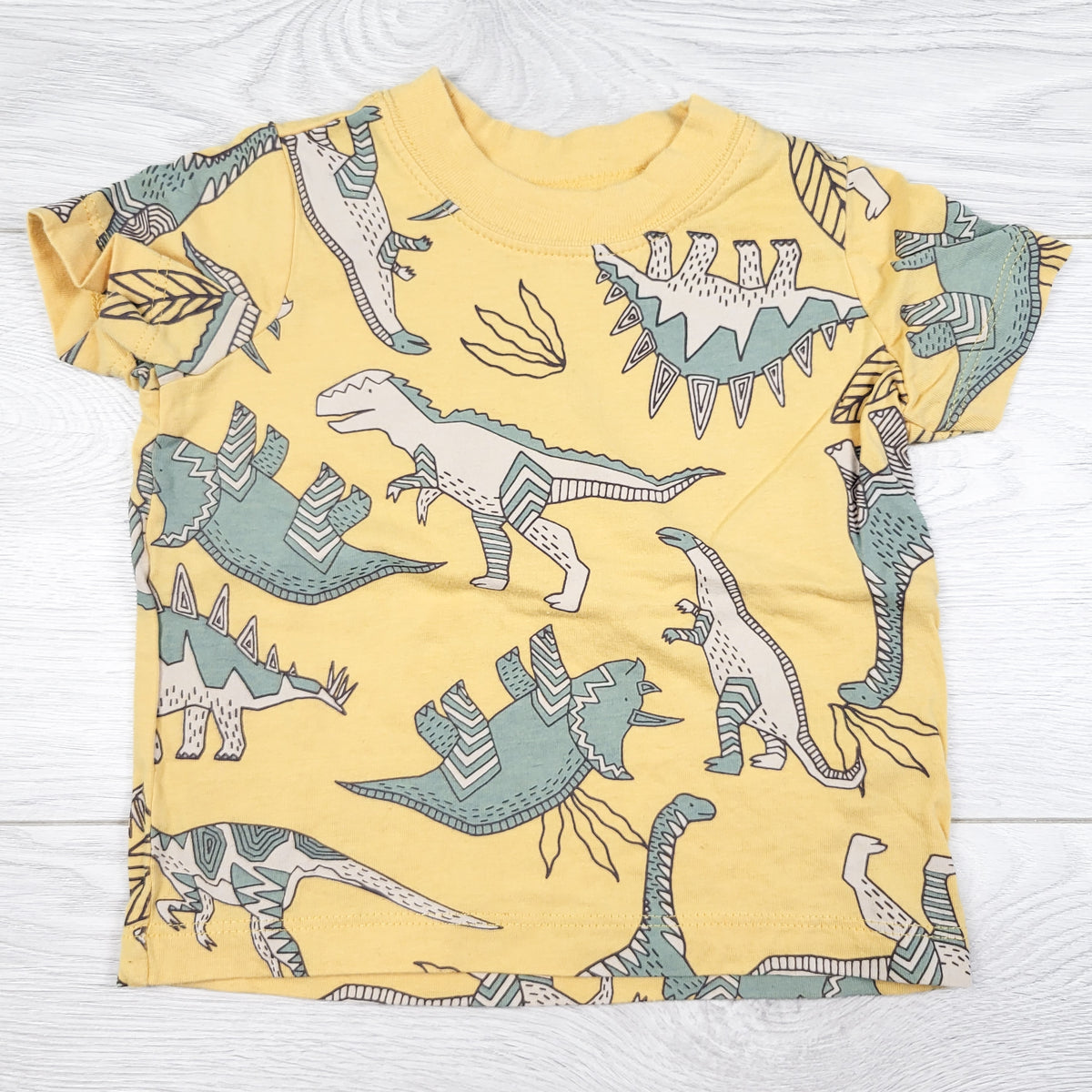 Carters yellow dinosaur print t-shirt. Size 6 months