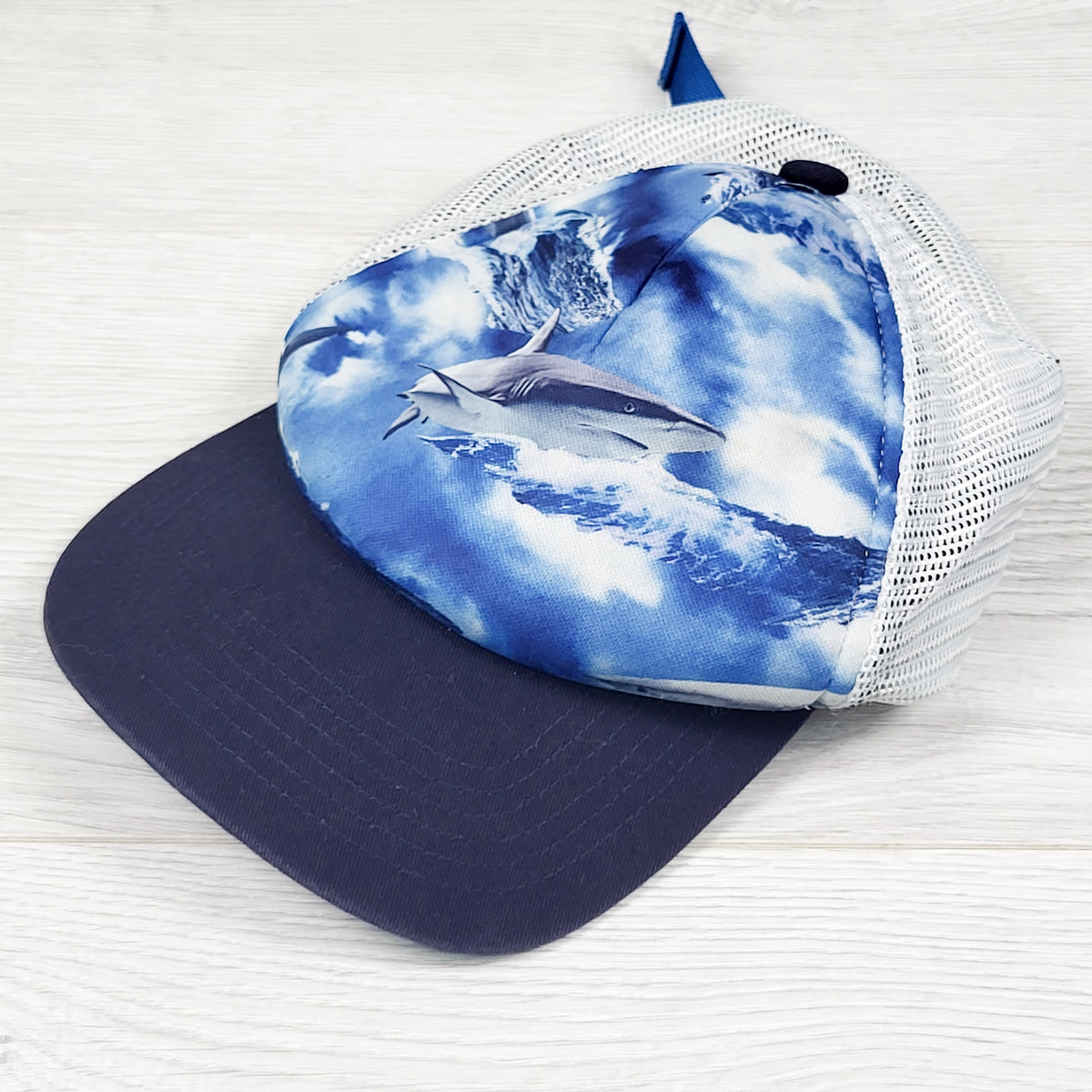 Shark print mesh back trucker hat. One size fits all