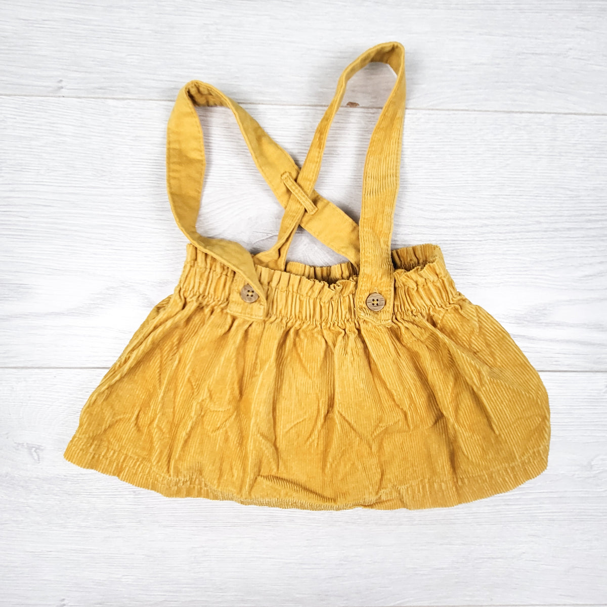 Carters yellow corduroy suspender skirt. Size 3 months