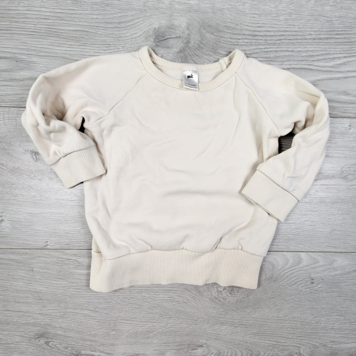 Little and Liveley cream coloured fleecy lined bamboo blend pullover. Size 6-12 months