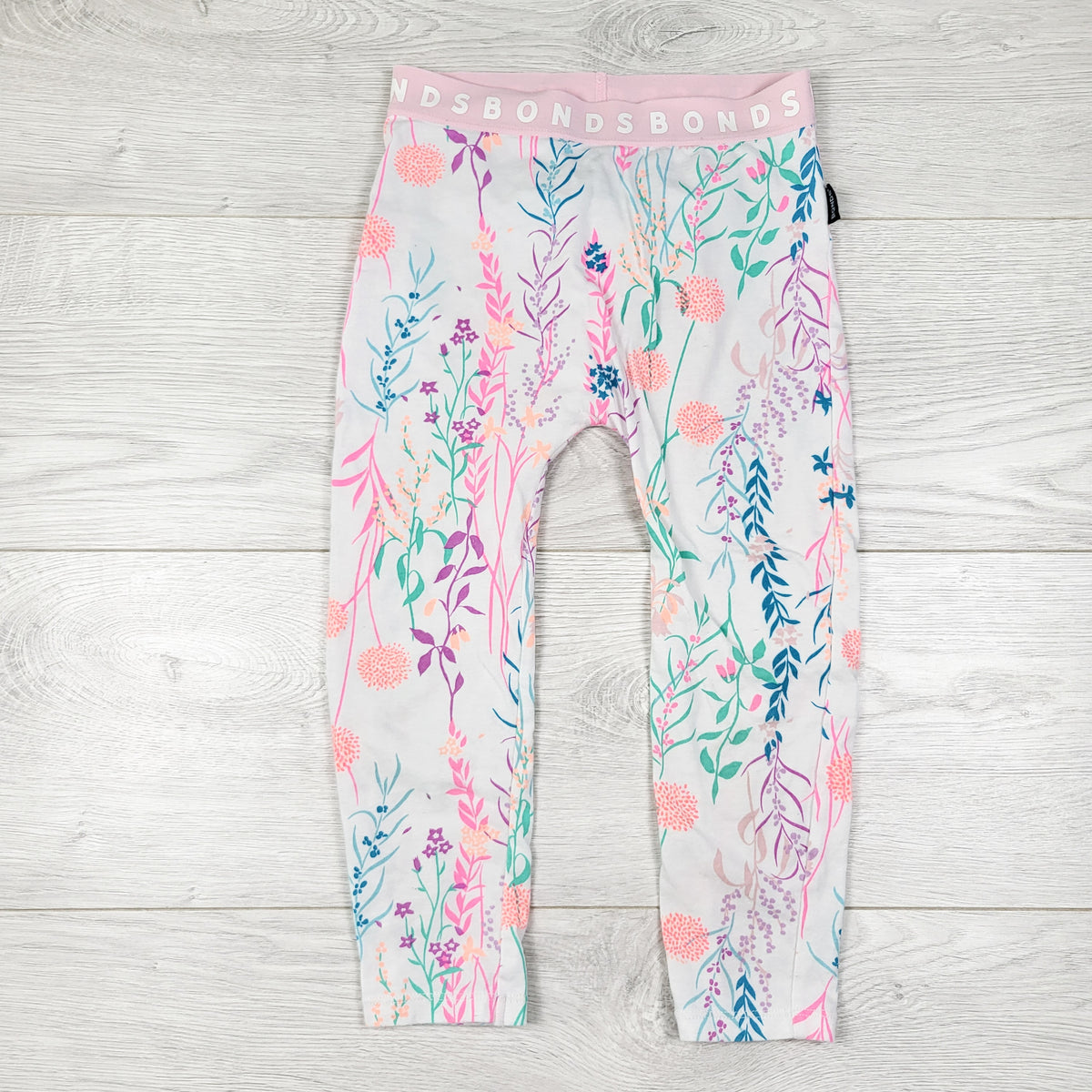 Bonds white and pink floral print leggings. Size 3T
