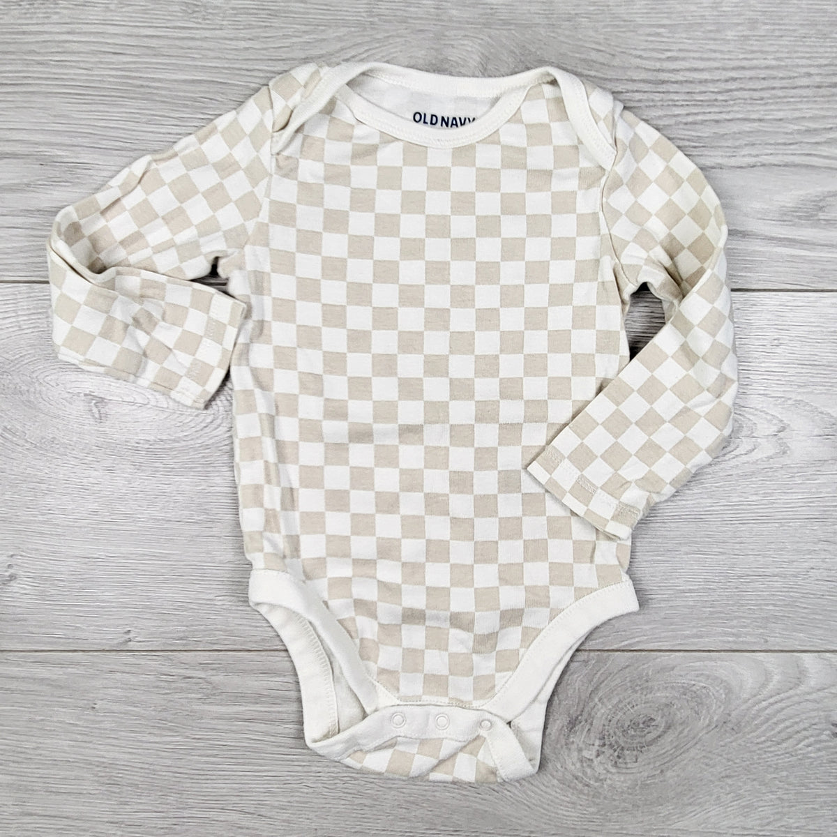 Old Navy beige and white checkerboard pattern bodysuit. Size 6-12 months