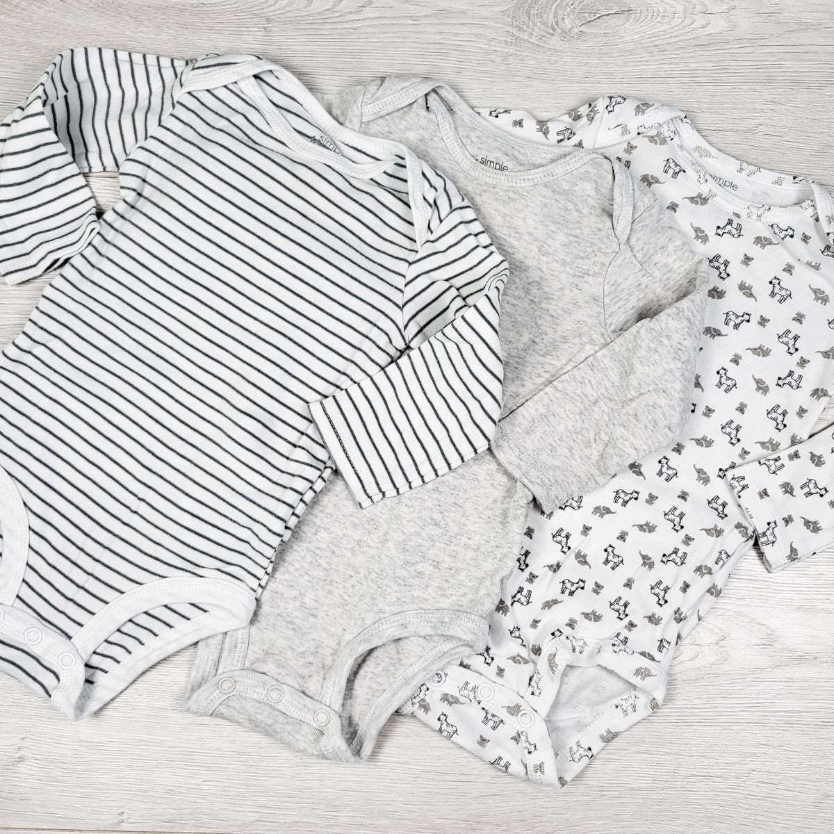 Simple Joys 3-pack neutral pattern bodysuit. Size 6-9 months