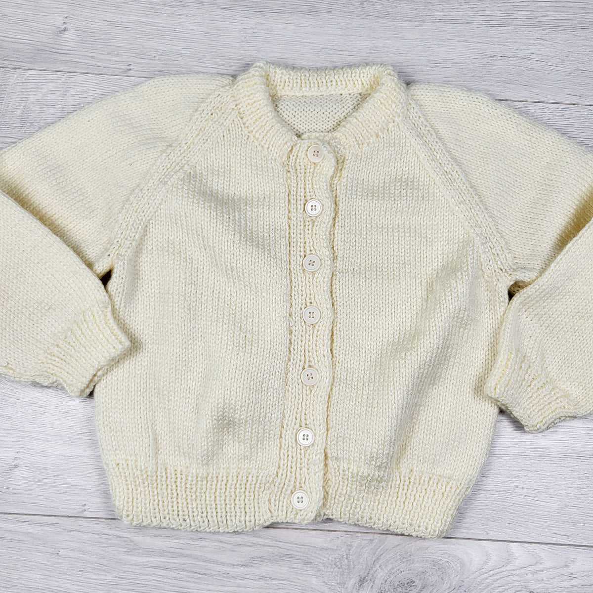 Handmade cream coloured cardigan sweater. Approx 2/3T