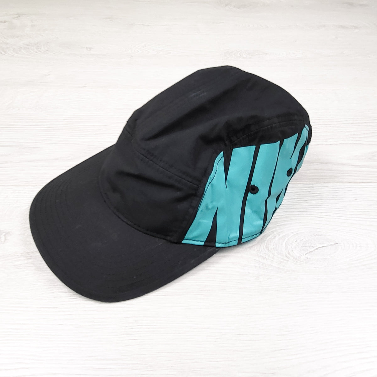 Nike black five panel hat. One size fits most (older kids)