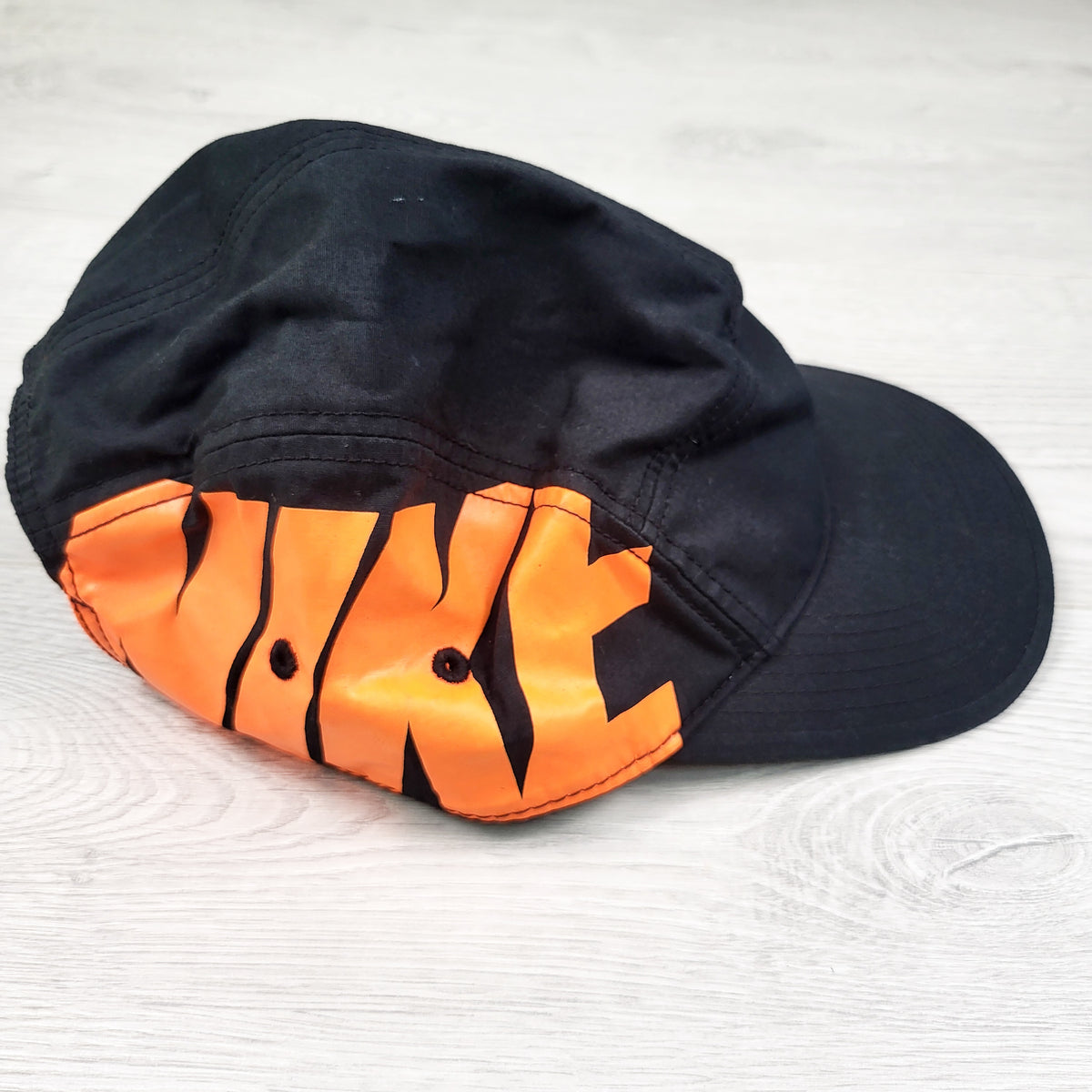 Nike black five panel hat. One size fits most (older kids)