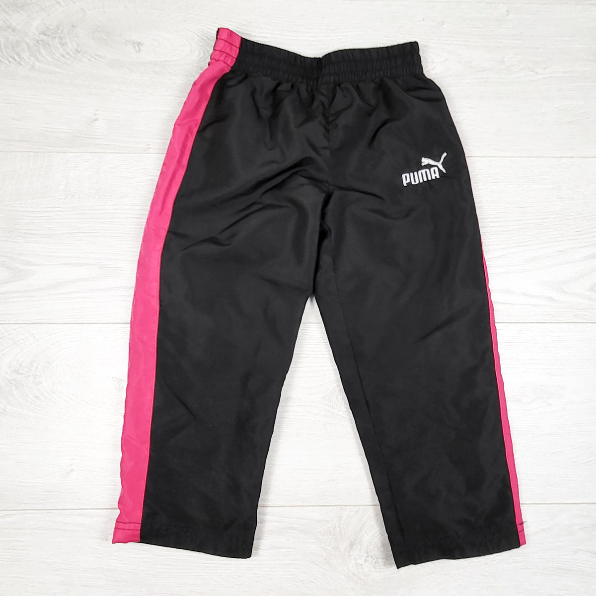 Puma black and pink windbreaker style track pants. Size 4T