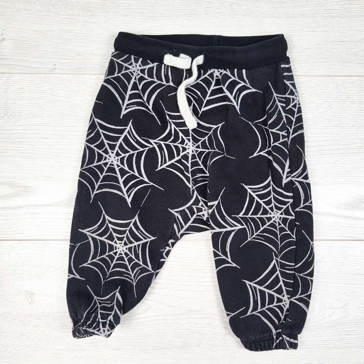 Old Navy black joggers with spider webs. Size 3-6 months