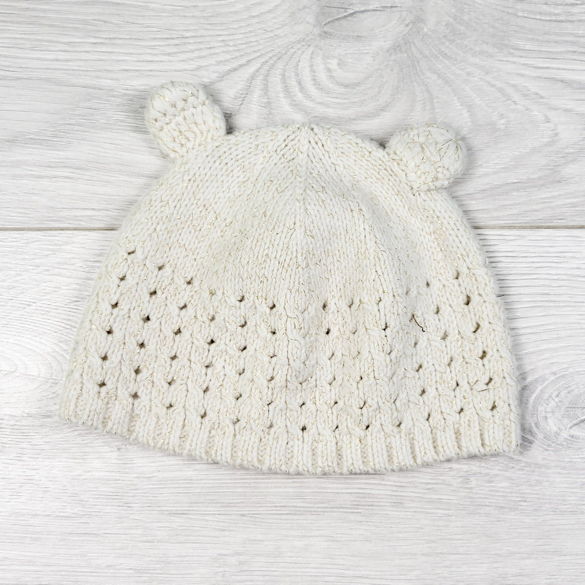 Old Navy cream toque with gold sparkle threading. Size 6-12 months