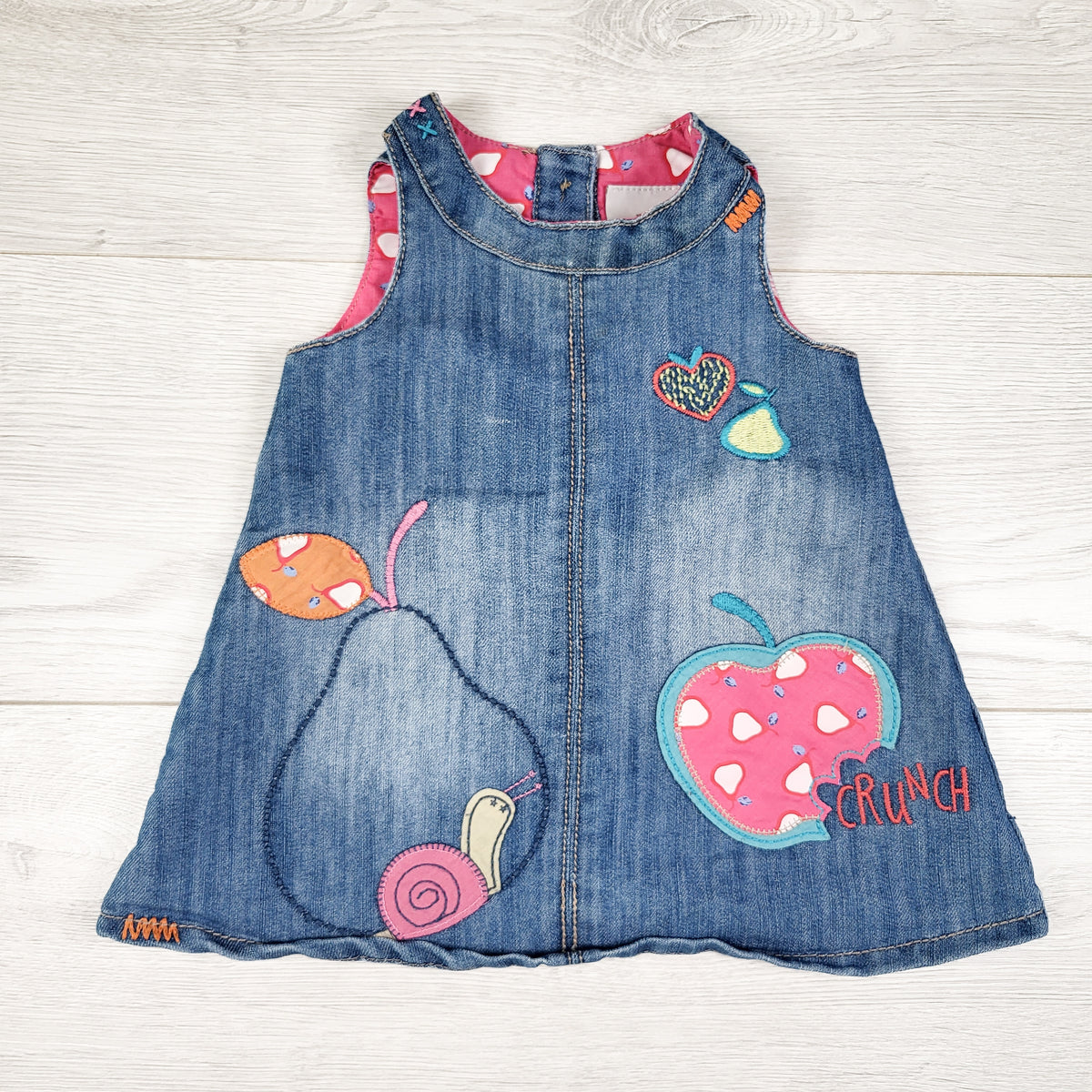 Next denim pinafore with fruit and snail appliques. Size 3-6 months