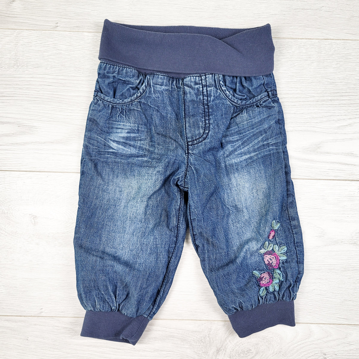 H and M pull-on denim pants with floral embroidery. Size 6-9 months