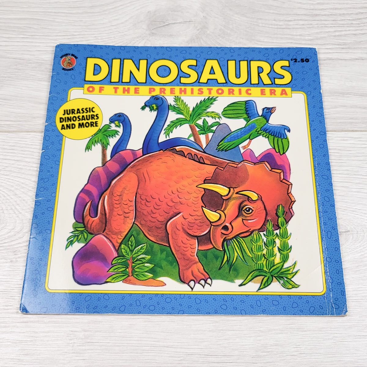 Dinosaurs of the Prehistoric Era. Soft cover book