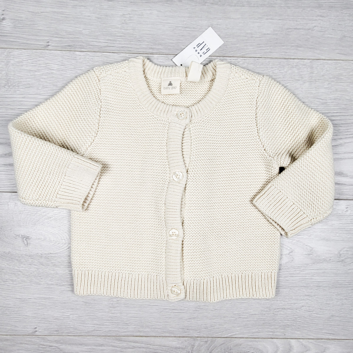 NEW - Gap cream coloured cardigan sweater. Size 6-12 months