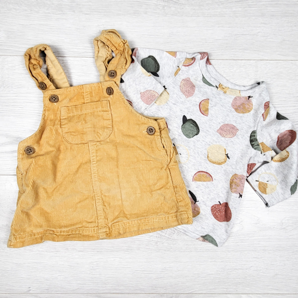 Carters yellow corduroy dress with matching fruit print top. Size 3 months