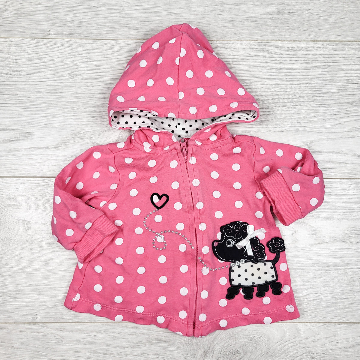 Pink polka dot zip up hoodie with dog. Size 0-3 months